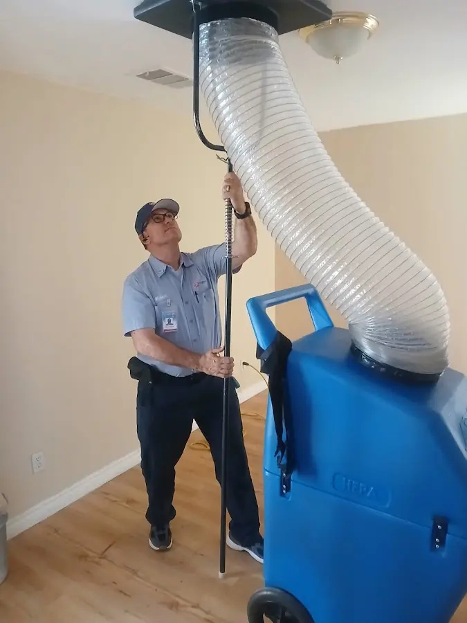 Furnace Tune-Up technician using HEPA equipment in Rocky Mount